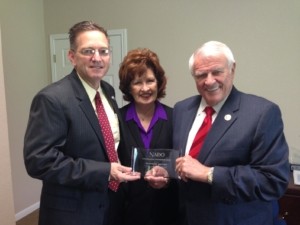 Jim Reed (left) presenting NADO Award to Congressman Carter (right)